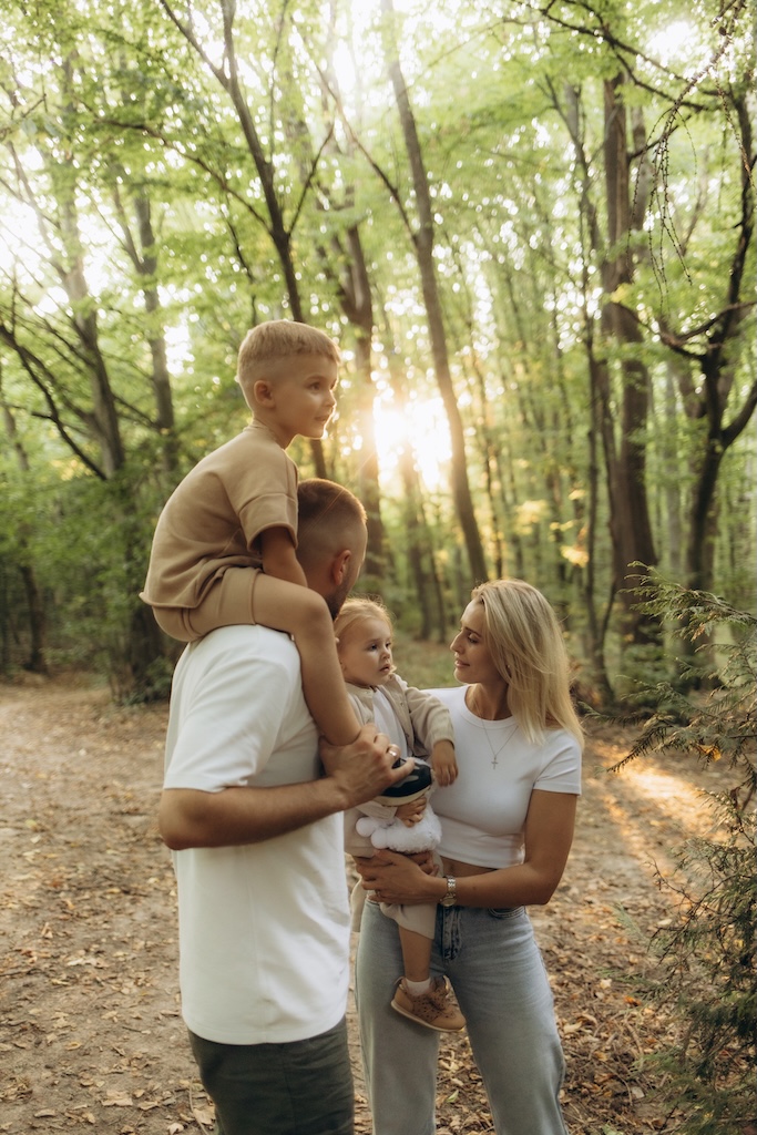 It's time for family quality time. Parents spending time with their children outside..